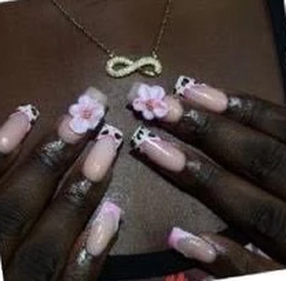 Short square nails with pink flowers and black-and-white French tips